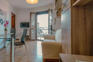 a living room with a couch and a table at House Carla in Bellano