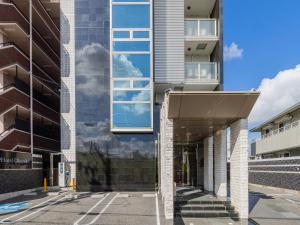 an external view of the facade of a building at MyHotel Okazaki in Okazaki