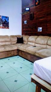 a living room with a couch and a bed at Casacapuba Jacaraipe Es in Serra +110 photos