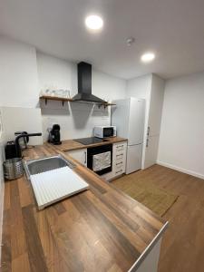 a kitchen with a counter top in a room at Apartamento Pla in Girona