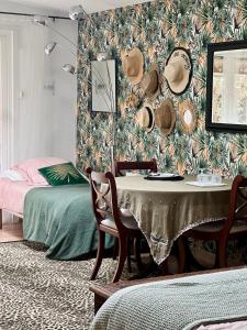 a bedroom with a table and a bed and a wall at LOU PANTAI in Levens +37 photos