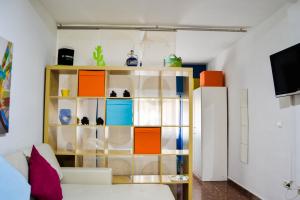 Televízia a/alebo spoločenská miestnosť v ubytovaní Marqués de Guadiaro 1 Apartamentos