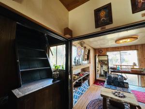 an interior view of a living room in a tiny house at Family Homestay Shirokuro Guesthouse in Nakakiri