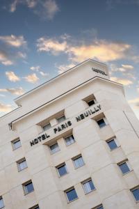 a building with the words wolf park hotel on it at Hôtel Paris Neuilly in Neuilly-sur-Seine
