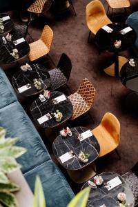 an overhead view of tables and chairs in a restaurant at Hôtel Paris Neuilly in Neuilly-sur-Seine