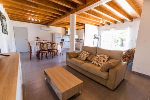 a living room with a couch and a table at Juine in Fargues