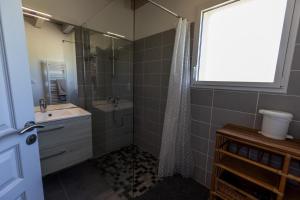 a bathroom with a shower and a sink and a mirror at Juine in Fargues +19 photos