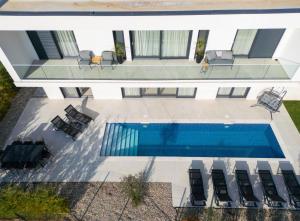 an overhead view of a swimming pool in a house at Villa Sensei in Linardići