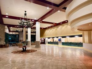 a lobby of a hotel with a chandelier at Copthorne Hotel Cameron Highlands in Cameron Highlands +95 photos