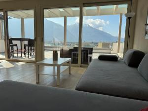 a living room with a couch and a table at Rotonda in Gordola