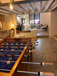 a room with a bunch of baseball racks in it at ruralhome sanroque in Altura