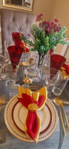 a table with a plate of food and flowers on it at Banbury causeway in Banbury
