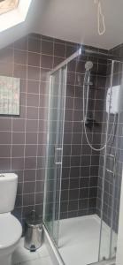 a bathroom with a shower and a toilet at Banbury causeway in Banbury