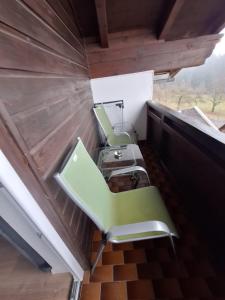 an overhead view of a room with chairs and tables at Ferienwohnung Sankt Josef 2 in Bodensdorf