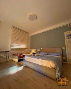 a bedroom with a large bed and a window at CarloAlberto23- Rooms by Homes in Ancona in Ancona