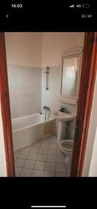 a bathroom with a tub and a toilet and a sink at Riad Four Rooms & Pool in Marrakesh +11 photos