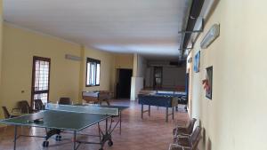 a room with ping pong tables and ping pong balls at Sogni di Montagna -Campitello Matese in San Massimo +9 photos