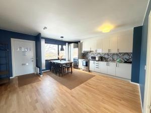 a kitchen with a table and a dining room at Fjordhotellet in Lysekil