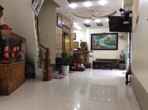 a large living room with a tv on a ceiling at Tay Dai Duong Guesthouse in Hai Phong