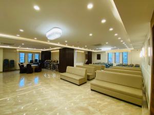 a large waiting room with couches and a salon at Hotel Ananta in Sasarām
