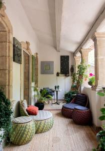 a living room with couches and a table at JK Moulin Paradou in Paradou