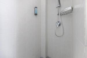 a shower with a shower head in a bathroom at Casa flowers in Ciampino +53 photos