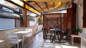 a restaurant with tables and chairs on a patio at I Portici - Cernobbio in Cernobbio