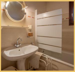 a bathroom with a sink and a mirror at L'appartement des Cimes I Doussard in Doussard +30 photos