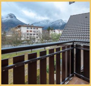 a balcony with a view of some mountains at L'appartement des Cimes I Doussard in Doussard