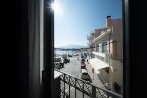 a view of a city street from a window at Gaia Apartments in Mytilene