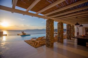 a villa with a view of the ocean at Maison Haute Mykonos in Ornos