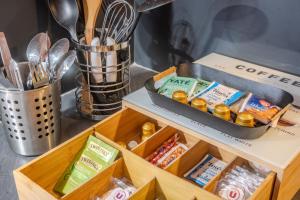 a drawer filled with different types of food at Ma Préférence - Studio Cozy - Parking Gratuit - Proche Commerces & Transports in Horbourg