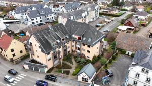 an aerial view of a large house in a city at Ma Préférence - Studio Cozy - Parking Gratuit - Proche Commerces & Transports in Horbourg