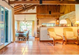 a kitchen and dining room with a table and chairs at Green Villa Gerês in Geres