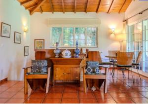 a living room with a table and chairs at Green Villa Gerês in Geres