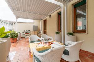 a dining room with a table and chairs at Dimora al Naviglio in Milan +15 photos