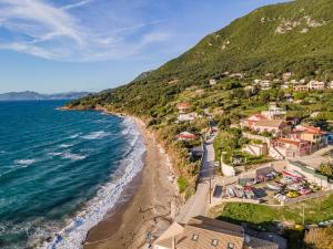 an aerial view of a beach with houses at 2-BR Apartment by the Sea in Paramonas +19 photos