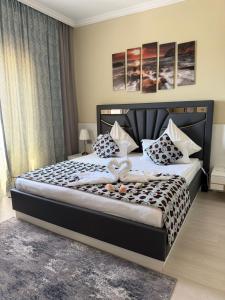 a bedroom with a large bed with pillows on it at Aktau Airport Hotel in Aktau +64 photos