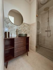 a bathroom with a sink and a shower at Lizzy's B&B in Maarssen +36 photos