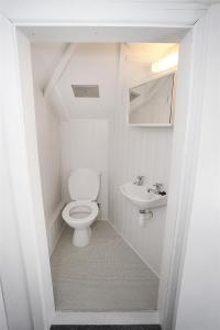 a small bathroom with a toilet and a sink at 2 Bed in Gower oc-hh411 in Parkmill +26 photos