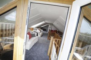 a view of a living room from the balcony of a house at 2 Bed in Gower oc-hh411 in Parkmill