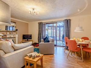 a living room with a couch and a table at 2 Bed in Mablethorpe oc-80703 in Sutton on Sea