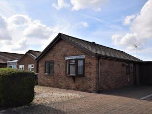 a brick house with a brick driveway at 2 Bed in Mablethorpe oc-80703 in Sutton on Sea