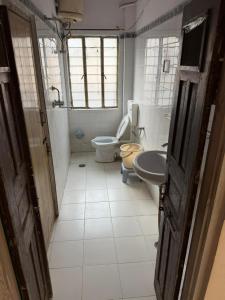 a bathroom with a toilet and a bidet and a sink at Doongri Haveli in Jaipur +18 photos