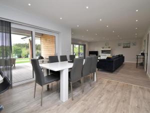 a dining room and living room with a table and chairs at 4 Bed in Oswestry oc-74110 in Kinnerley
