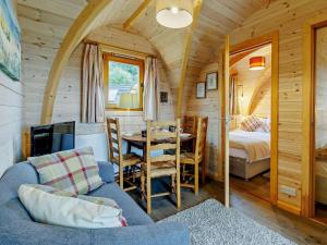 a room with a couch and a table in a tiny house at 2 Bed in Shrewsbury oc-93396 in Leighton