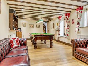 a living room with a pool table in it at 2 Bed in Corwen oc-77351 in Corwen