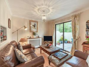 a living room with a couch and a table at 2 Bed in Narberth oc-tc84026 in Narberth