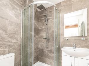 a bathroom with a shower and a sink at 4 Bed in Bala oc-75288 in Llandderfel +15 photos