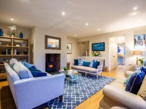 a living room with two couches and a fireplace at 5 Bed in Whitchurch oc-77696 in Whitchurch